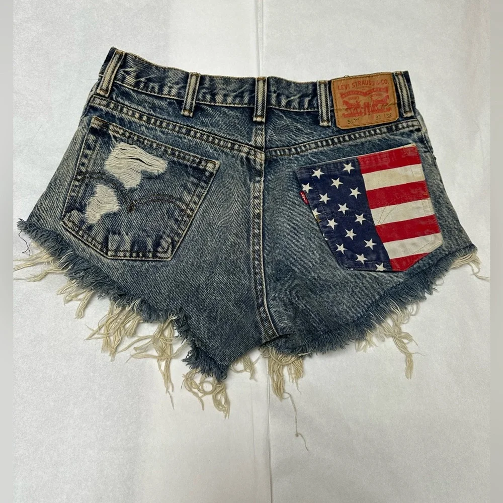 Levi's Distressed Denim Cutoff Shorts with American Flag Pocket - Picture 1 of 7